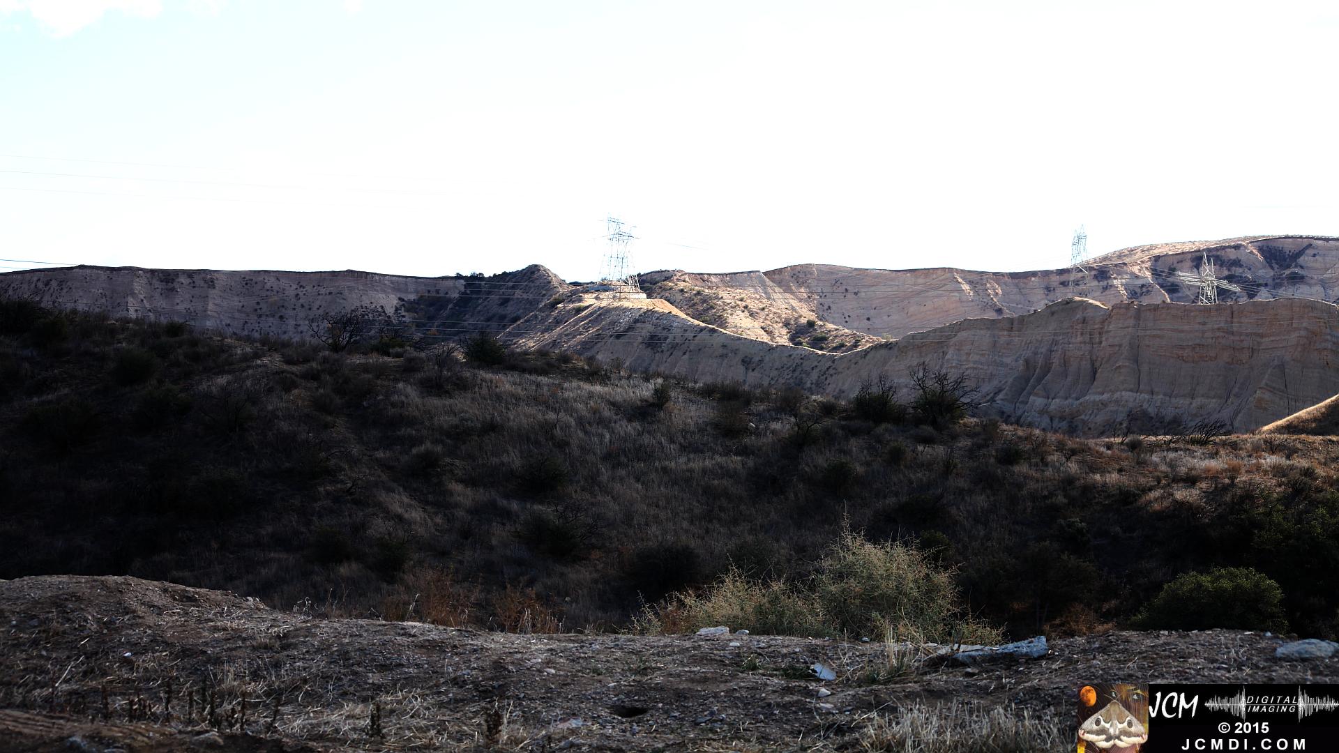 Landslide, buckled pavement, and terrain at Vasquez Canyon Road in Santa Clarita, CA filmed 11-25-2015